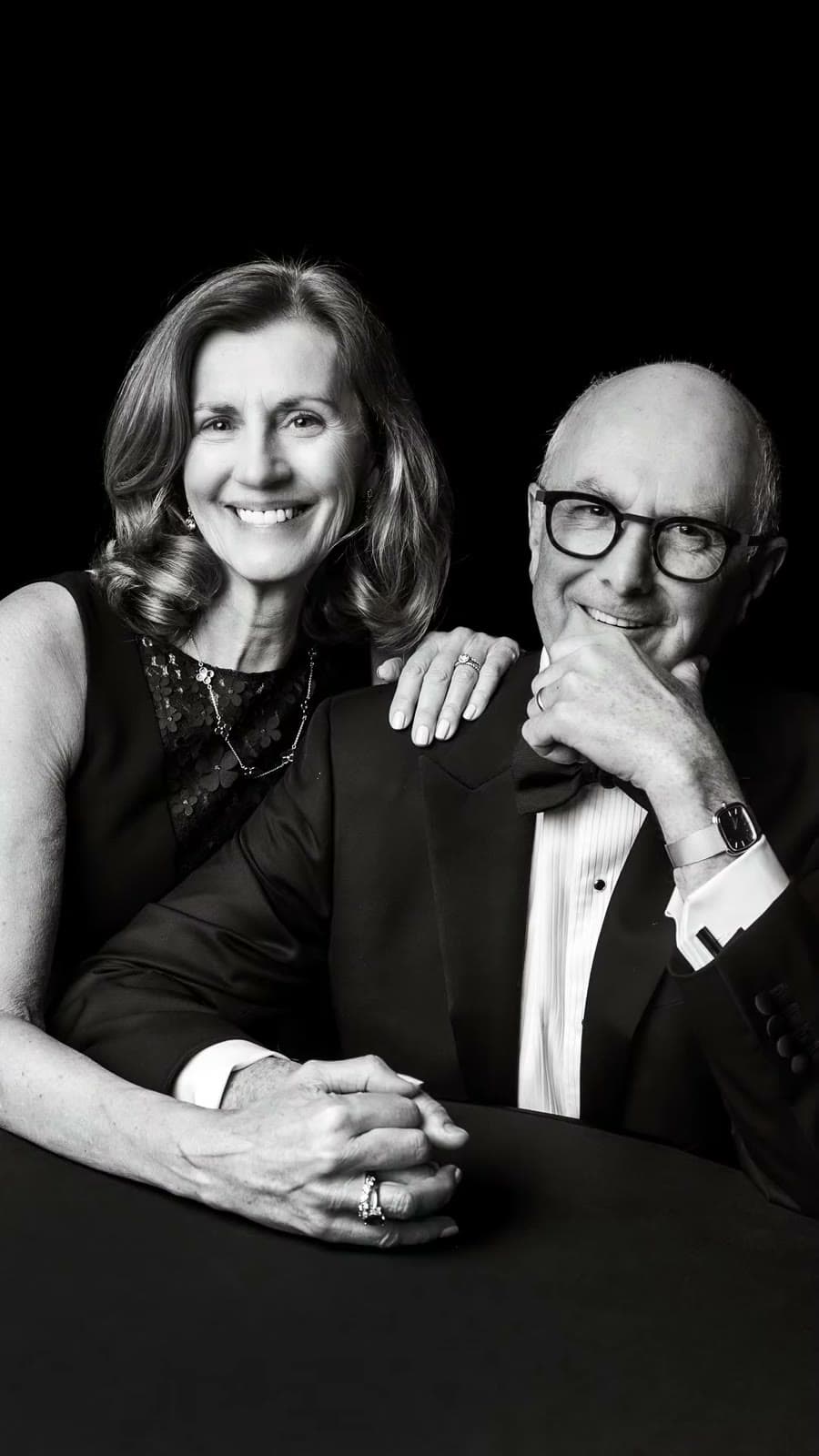 Parents of the couple on the black drape, black and white
