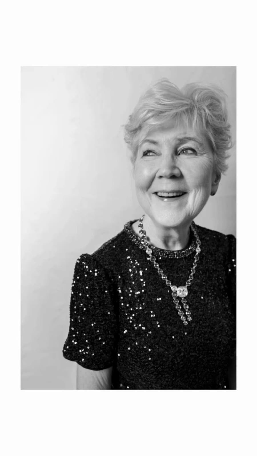 Grandmother in sequins, black-and-white portrait