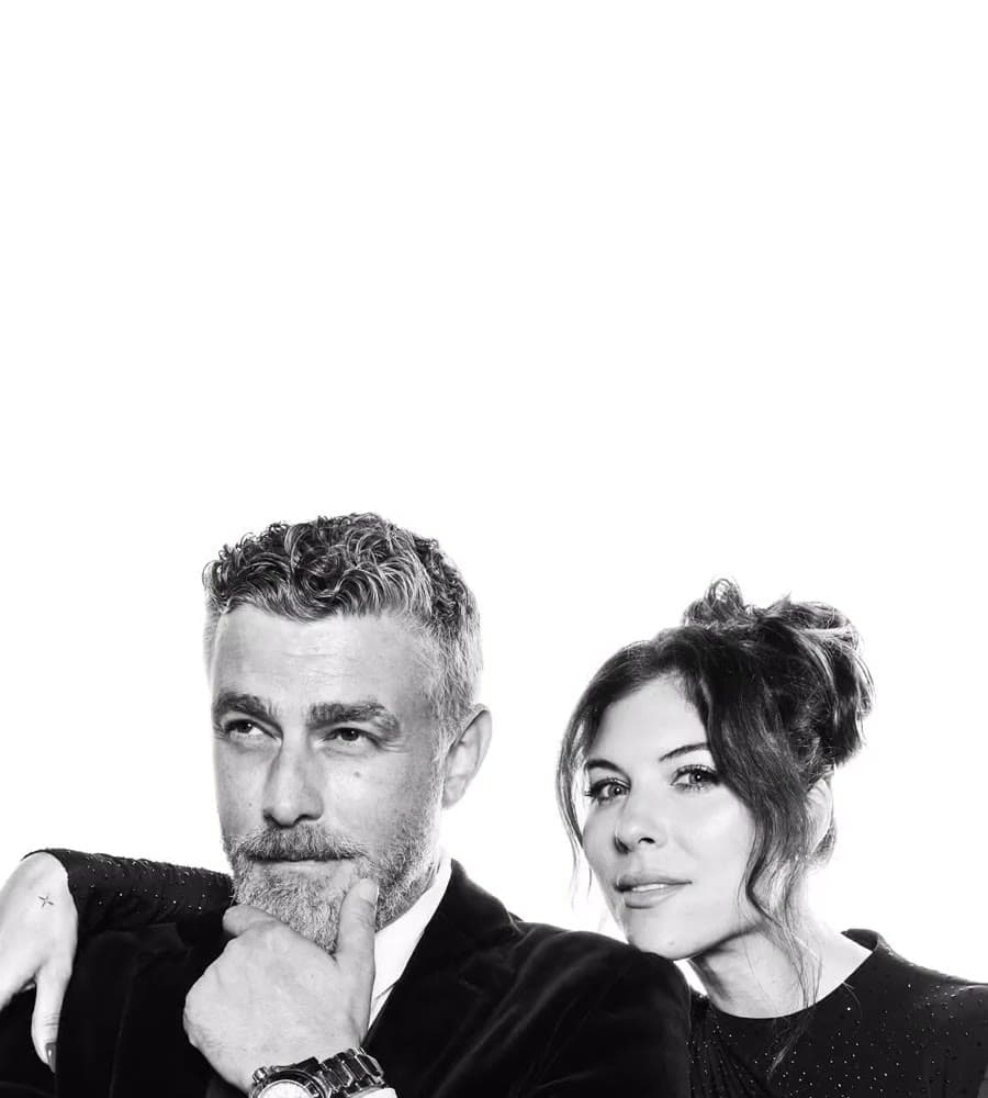 Couple in black tie, high-key studio portrait